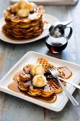 Waffles with vanilla ice cream and maple syrup