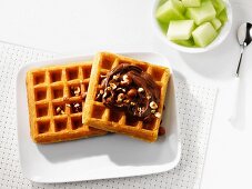 Waffles with chocolate spread and melon