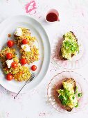 Corn cakes with bacon and courgette and bread topped with herb omelette