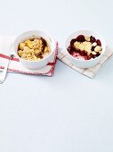 Two sweet fruit bakes topped with crumbles