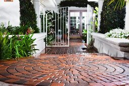 Brick walkway leading to open gate at Laguna Niguel; California; USA