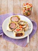 Pork fillet wrapped in puff pastry with a tomato salsa