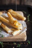 Puff pastry rolls filled with cream cheese, honey and thyme