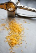 Grated cheddar and a cheese grater