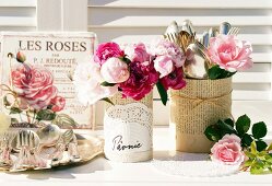 Nostalgic arrangement with roses & peonies on table