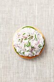 A slice of toast topped with radish quark and chives