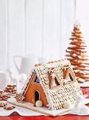 A gingerbread house and gingerbread stars for Christmas