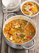 Minestrone with white cabbage, courgettes, tomatoes, potatoes, carrots and peppers