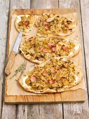 Tarte flambée with white cabbage, onions and Pancetta