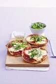 Marinated bocconcini pizzas with tomatoes and rocket