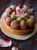 Raspberry tartlet with matcha tea and darjeeling