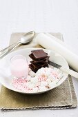 Chocolate, marshmallows, sugar pearls and pink icing