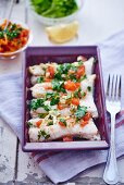 Pollack fillets with tomatoes and parsley