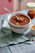 Chocolate pudding with caramel and peanuts