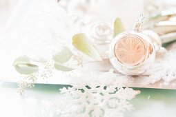 Arrangement of silver Christmas baubles and stylised snowflakes