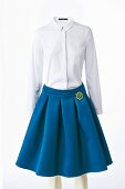 A white blouse and a blue circle skirt
