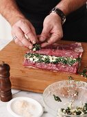 Lamb roulade being made