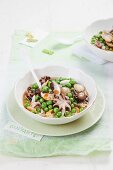 Stew with peas and octopus