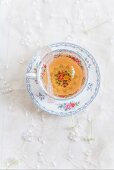 Tea in a floral-patterned cup (seen from above)