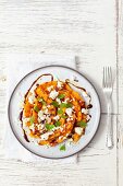 Grilled pumpkin with feta cheese and balsamic dressing