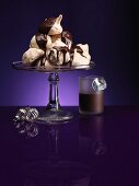 Chocolate meringues with chocolate sauce for Christmas