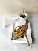 Grilled sea bass with soy sauce