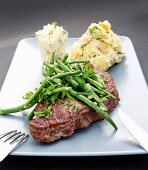 Beefsteak with mashed potatoes and green beans