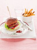 Spicy lentil burger with ketchup and chips