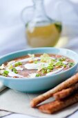 Vegetable soup with sour cream and grilled bread