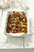 Oven-baked carp with chanterelle mushrooms and sour cream