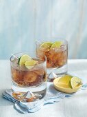 Vodka-Cola with limes and ice cubes