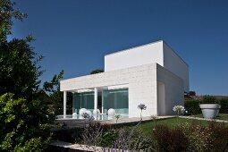 Contemporary house with pool and summery garden