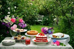 A cake buffet in a summer garden