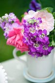 Bouquet of summer flowers decorating buffet table (close-up)