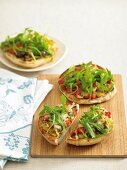 Small vegetable pizzas with rocket