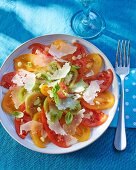 A colourful tomato salad with Parmesan and basil