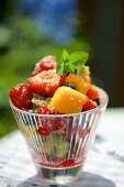 A fruit salad with quinoa and mint