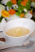Indian soup with coconut, pistachios and almonds