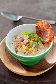 Sweetcorn soup with ham, prawns and parsley