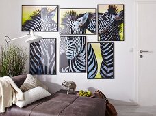 Poster with zebra motifs arranged as African collage in multiple, small picture frames