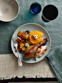 Turkey leg with mashed sweet potatoes and oven-roasted vegetables