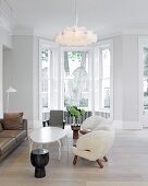 Private Apartment, London, United Kingdom. Architect: Hill Mitchell Berry, 2014. Extravagant, white armchairs and oval table with curved legs in living room