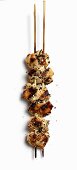 A grilled chicken wing skewer