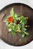 Salad with fresh flowers and amaranth wafers