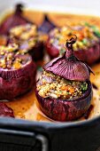 Red onions filled with couscous, dried apricots and herbs