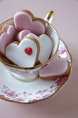 Heart-shaped biscuits in a teacup for Valentine's Day
