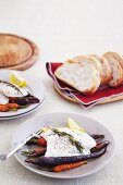 Oven fish with baked colourful carrots and rosemary