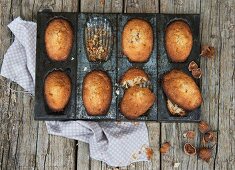 Hazelnut madeleines in a baking tin