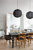 Eclectic, elegant dining room in black and white colour scheme with period ambiance