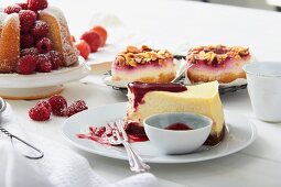 Vanilla cake, cheesecake and berry tartlets with almonds on a cake buffet